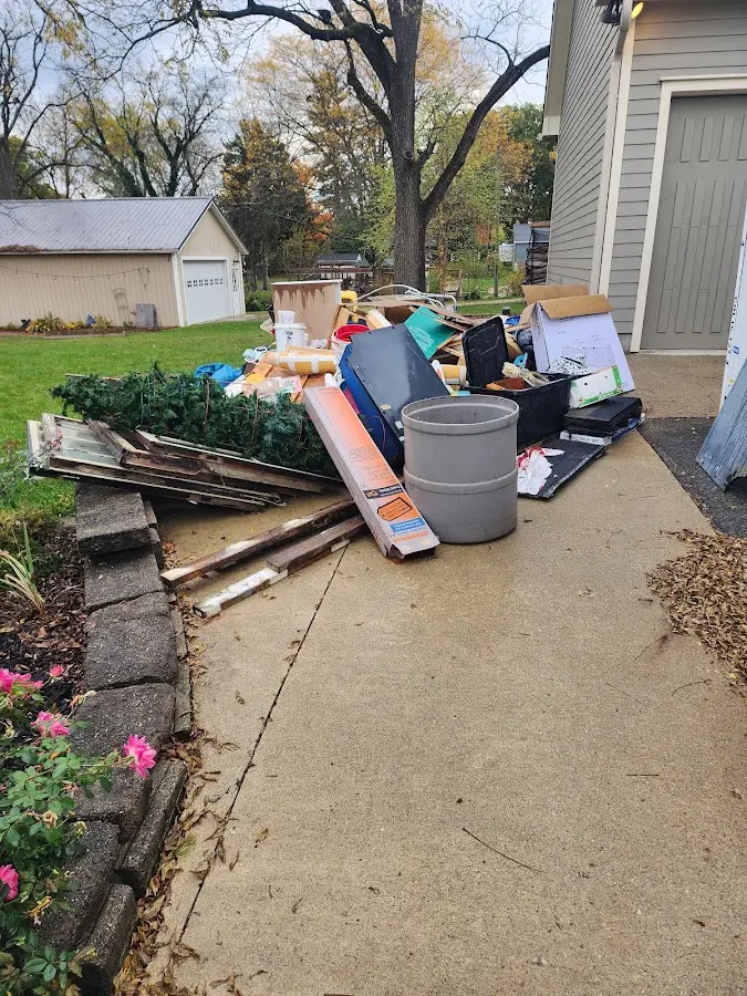 Dumpster being loaded with debris for Commercial Dumpster Rental in Lady Lake